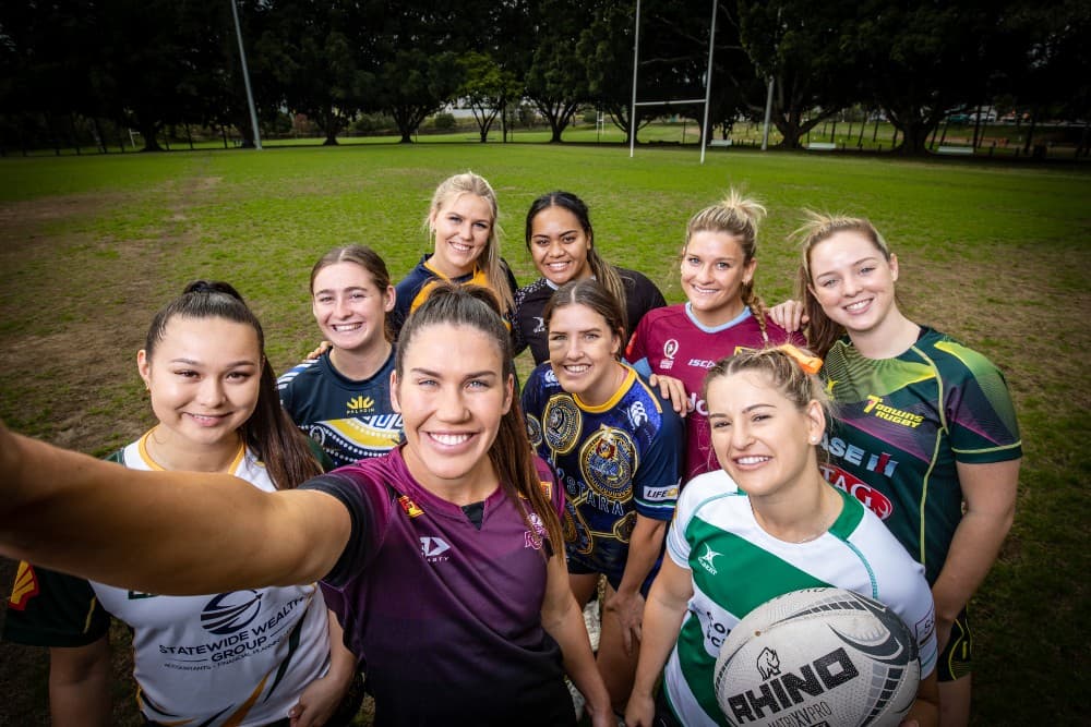 Caption: Charlotte Caslick with players from eight of the Queensland Premier Sevens teams. Photo: Brendan Hertel, QRU